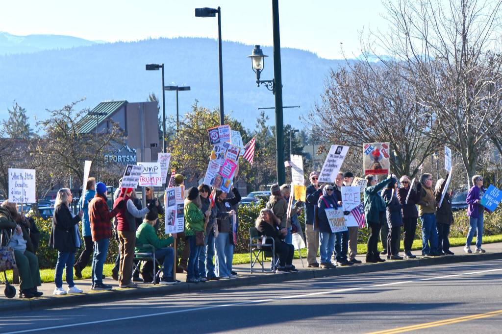 Sequim Gazette photo by Monica Berkseth/
Peaceful protesters gather along Washington Street on Jan. 19 (Martin Luther King Jr. Day) during an event organized by Indivisible Sequim.
