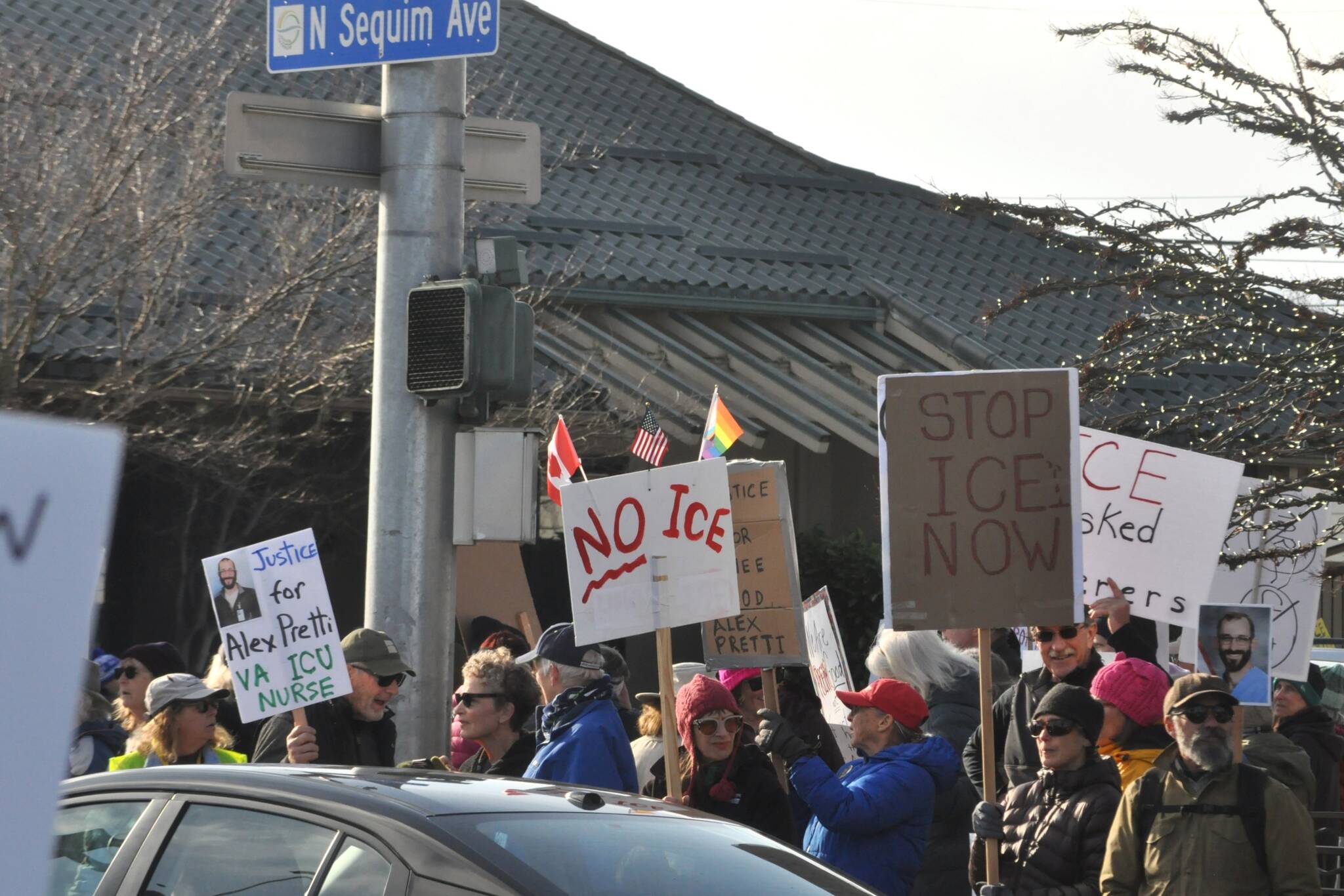 Sequim Gazette photos by Matthew Nash
Locals hold signs up at the corners of Washington Street and Sequim Avenue during a peaceful protest on Sunday, Jan. 25.
