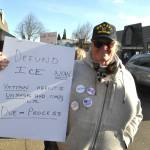 Beth Pahl of Sequim with Elvis the dog participates in a Jan. 25 rally in downtown Sequim. Pahl said U.S. Immigration and Customs Enforcement (ICE) agents have a complete disregard for proper procedure following the shooting death of Alex Pretti in Minneapolis, Minnesota.