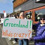 Sequim Gazette photo by Matthew Nash/
Kathie Wilkinson of Port Townsend alongside Dora Whittaker of Sequim holds a sign opposed to the U.S. taking over Greenland. Wilkinson said shes attended multiple protests on the Olympic Peninsula. If you dont like something you have to speak up, Wilkinson said.