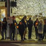 Sequim Gazette photo by Monica Berkseth/ According to organizers, about 150 people gathered at Sequims Centennial Place for the candlelight vigil held in protest of killings of American citizens by federal agents.