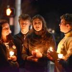 Sequim Gazette photo by Monica Berkseth/ U.S. Rep. Emily Randall (D), left, speaks with Sequim High School students at a candlelight vigil held Tuesday, Jan. 27, organized by Indivisible Sequim in honor of Minneapolis residents Renee Good and Alex Pretti. Both U.S. citizens, the two were shot and killed by federal agents in separate incidents related to a crackdown on illegal immigrants.