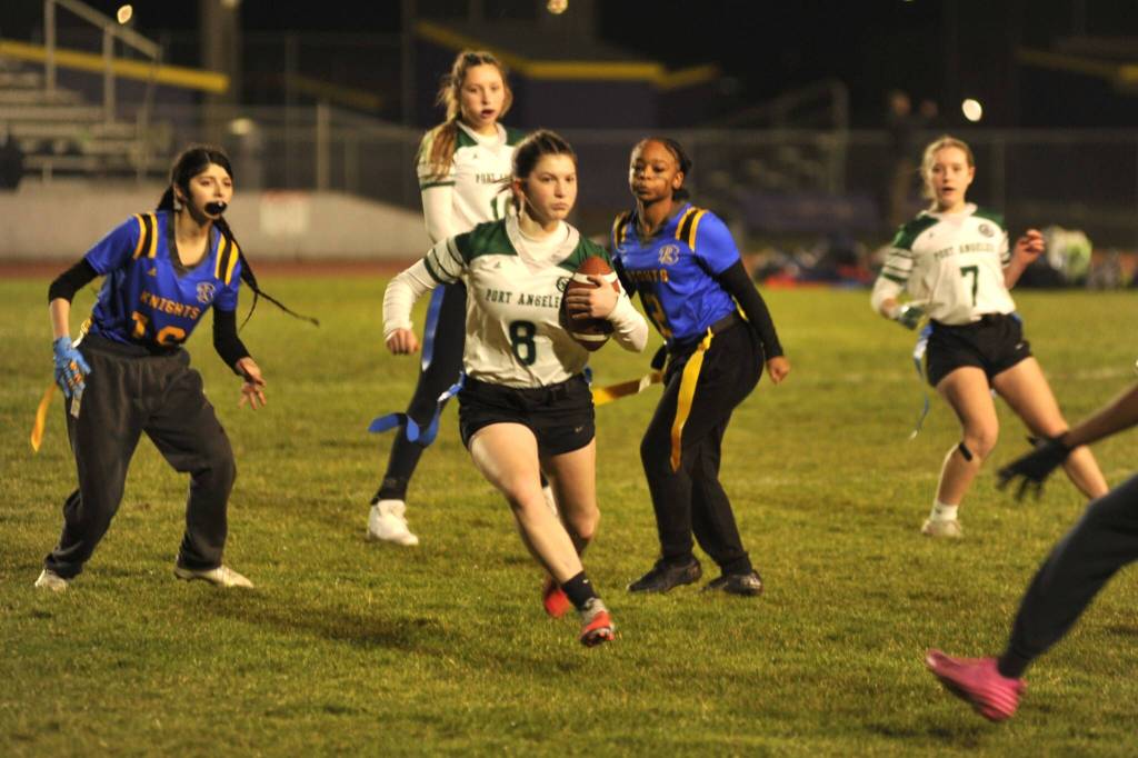 Sequim Gazette photo by Matthew Nash/
Port Angeles Miriam Cobb rushes through Bremerton defenders in the final regular season game of the season on Jan. 28 in Sequim.