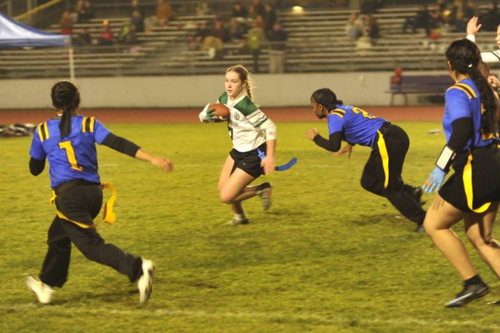 Sequim Gazette photo by Matthew Nash/
Addy Fox avoids Bremerton defenders as she sweeps to the side during a rush on Jan. 28 in Sequim.