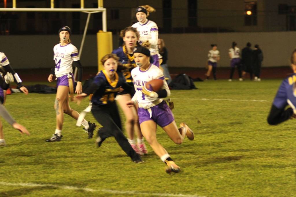 Sequim Gazette photo by Matthew Nash/ Sequims Kiley Winter runs the ball in for a touchdown against Bainbridge on Jan. 28. The Wolves finished the regular season 12-2 and will play in districts this weekend to determine if theyll go to the first 2A state tournament.