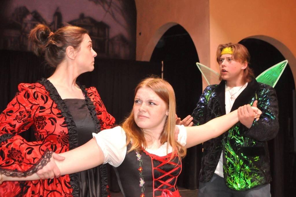 Sequim Gazette photo by Matthew Nash/
Bernie Riding-Hood (Trinity Myers) is pulled between the opinions of her mother (Anna Risinger) and uncle Fairy Maximus (August Maberry) as to whether shes ready to go in the woods.