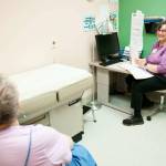 Photos by Austin James
Kathi Gunn, right, a chronic healthcare nurse practitioner for the Dungeness Valley Health and Wellness Clinic, speaks with a patient. This year, thanks to volunteers and donors, the clinic will mark 25 years of providing free healthcare services to those who are uninsured and under-insured.