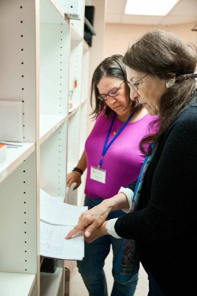 Clinic Director Rose Gibbs, right, confers with chronic care nurse Julie Ann Koehlinger.