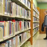 Sequim Gazette photo by Matthew Nash/
Suzan Noyes of Sequim looks for some books to check out at the Sequim Temporary Library on Jan. 31. She visits each week and reads about five books a week, she said. With the temporary library closing that day, she plans to wait it out and look for books at the Friends of Sequim Library sale to hold her over until the renovated library reopens.