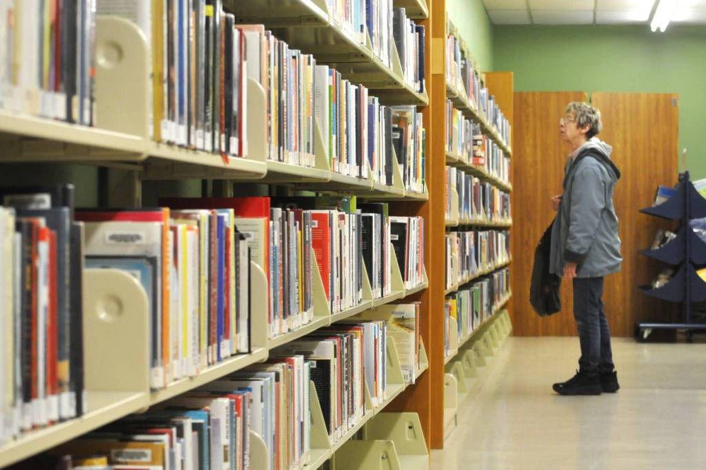 Sequim Gazette photo by Matthew Nash/
Suzan Noyes of Sequim looks for some books to check out at the Sequim Temporary Library on Jan. 31. She visits each week and reads about five books a week, she said. With the temporary library closing that day, she plans to wait it out and look for books at the Friends of Sequim Library sale to hold her over until the renovated library reopens.