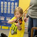 Photo courtesy Sequim Community Orchestra/ Sam Schmidt concentrates while playing the E string song.
