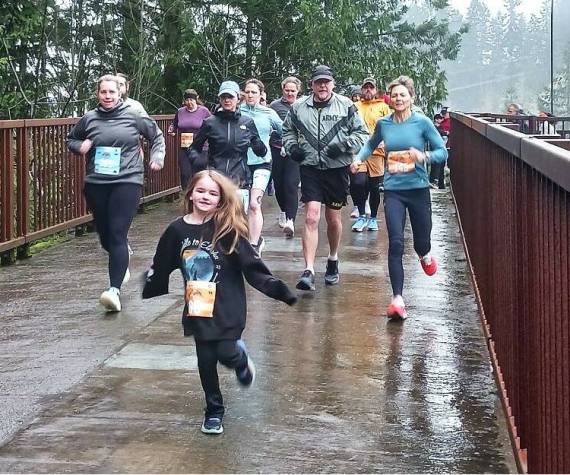 <p>Olympic Peninsula News Group photo by Pierre LaBossiere/</p>
                                <p>Runners in the Run The Peninsula&rsquo;s Elwha Bridge Run take off into the rain Saturday morning.</p>
