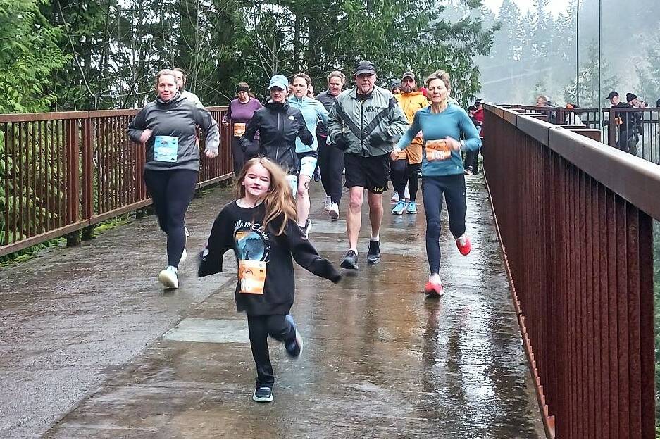 Olympic Peninsula News Group photo by Pierre LaBossiere/
Runners in the Run The Peninsulas Elwha Bridge Run take off into the rain Saturday morning.