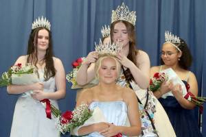 Aliya Gillet, the 2025 Clallam County Fair queen, crowns Keira Headrick as the 2026 queen during a ceremony on Saturday at the Clallam County Fairgrounds. At left is princess Julianna Getzin and at right is princess Jasmine Green. The other princesses, not pictured, are Makenzie Taylor, Molly Beeman and Tish Hamilton. (Dave Logan/for Peninsula Daily News)