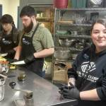 Photo courtesy Boys & Girls Clubs of the Olympic Peninsula/ Mollys Meals crew members, from left, Emma Anderson, Phillip McIntyre and Alexandria Souza work in the kitchen at the Carroll C. Kendall Teen Center, also known as the Sequim Boys & Girls Club.