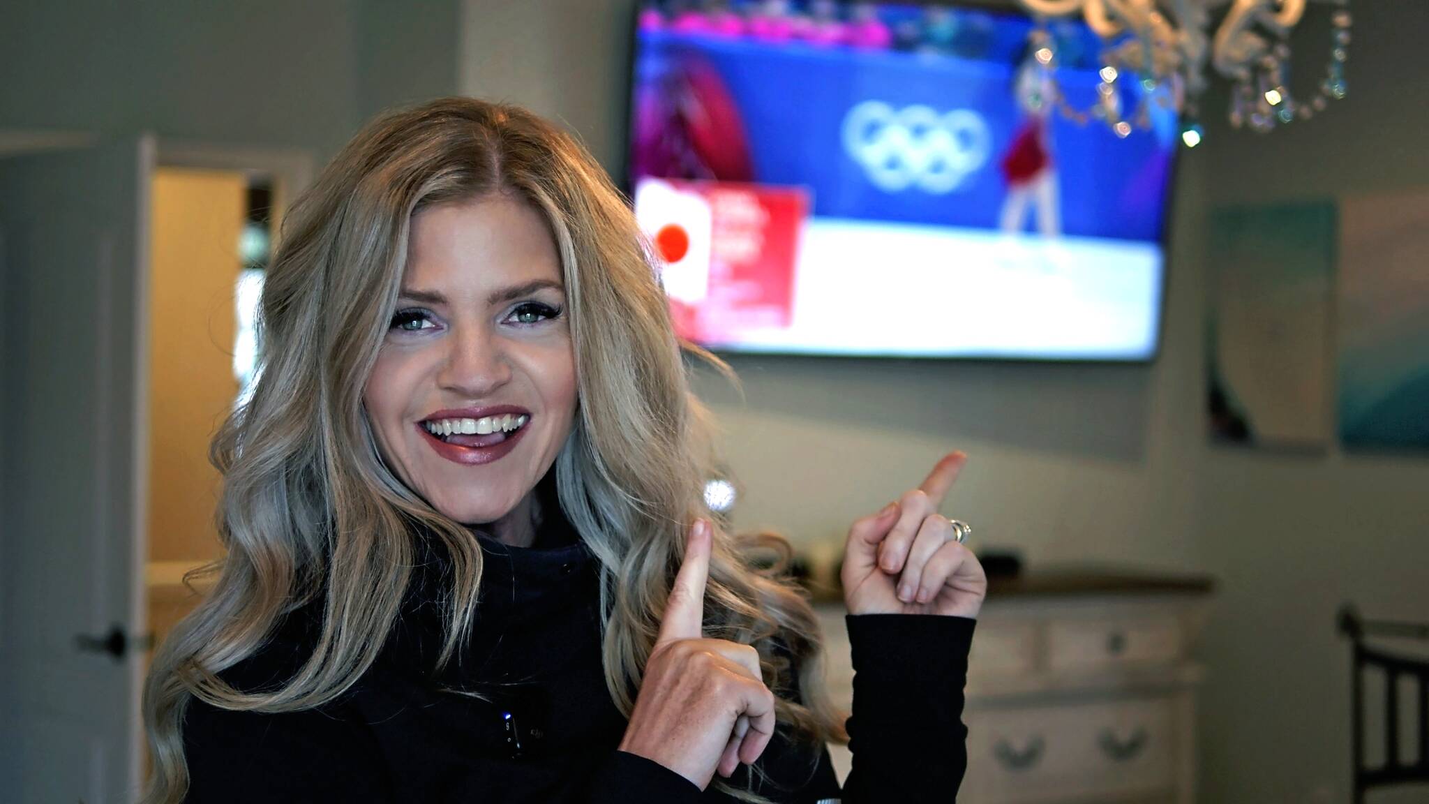 Photo courtesy Jennifer Thomas/
Jennifer Thomas watches Japanese skaters Masaya Morita and Utana Yoshida skate to her song Rise of the Phoenix during the Winter Olympics. With their score in the Ice Dance – Rhythm Dance routine for team figure skating, Japan won a silver medal.