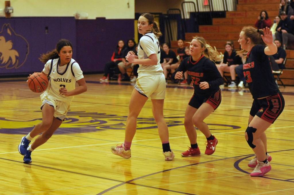 Sequim Gazette photo by Matthew Nash/ Hailey Wagner sets a screen for Jordyn Julmist on Feb. 20 against Orting.