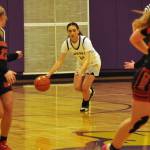 Sequim Gazette photo by Matthew Nash/ Olivia Barros drives the ball up the court in the fourth quarter against Orting.