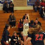 Sequim Gazette photo by Matthew Nash/ Rilynn Whitehead goes up for a 3-pointer over Orting defenders.
