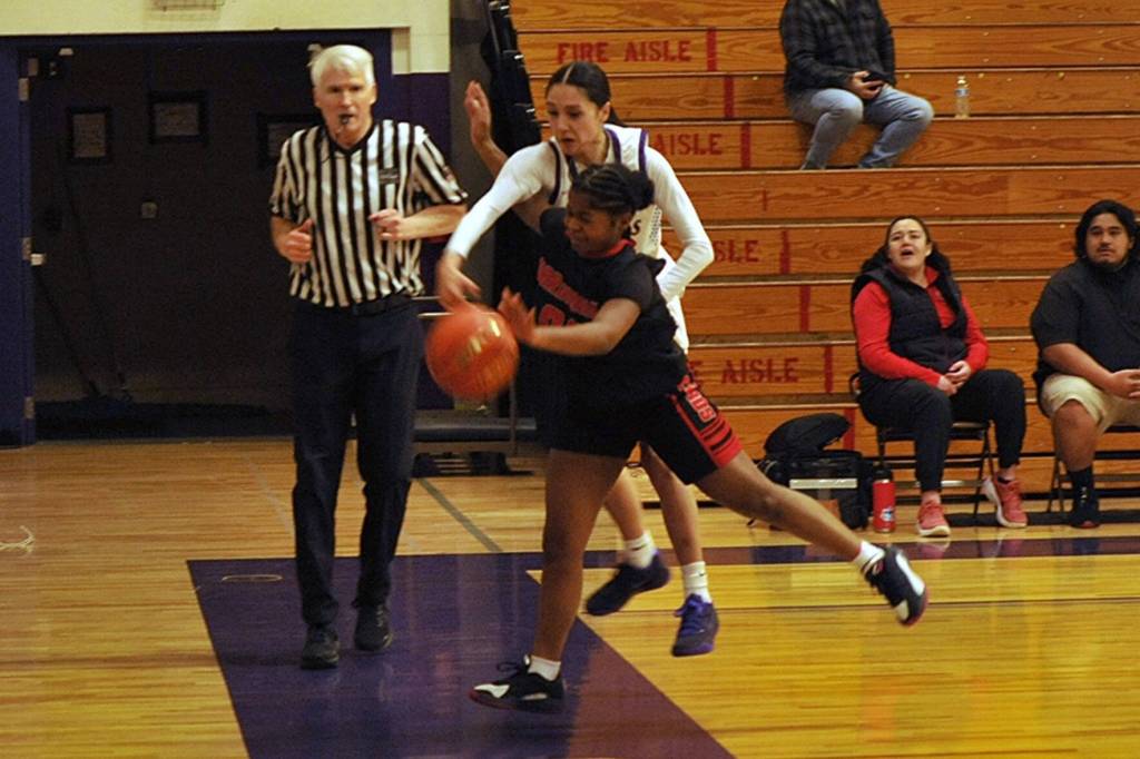 Sequim Gazette photo by Matthew Nash/ Sequims Gracie Chartraw attempts to ricochet the ball off an Orting player on Feb. 20.
