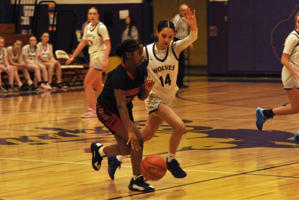 Sequim Gazette photo by Matthew Nash/ Gracie Chartraw picks up her defense at halfcourt.