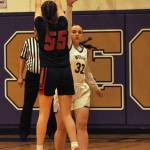 Sequim Gazette photo by Matthew Nash/ Charlie Nolan (32) attempts to block a shot by Ortings Macy Sullenger.