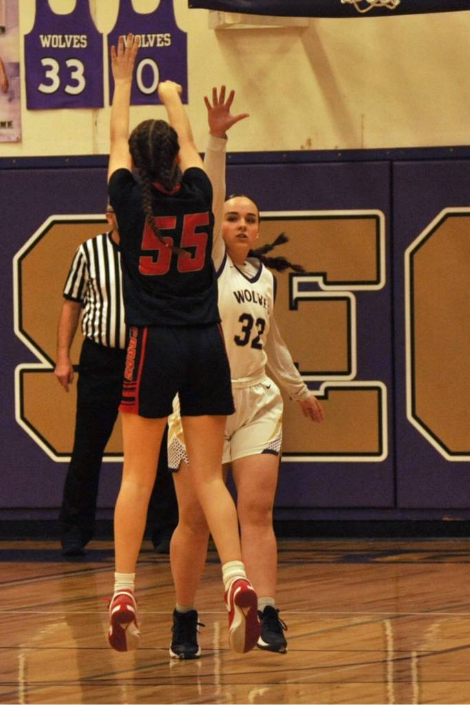 Sequim Gazette photo by Matthew Nash/ Charlie Nolan (32) attempts to block a shot by Ortings Macy Sullenger.