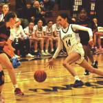 Sequim Gazette photo by Matthew Nash 
Gracie Chartraw drives through Orting defenders on Feb. 20.