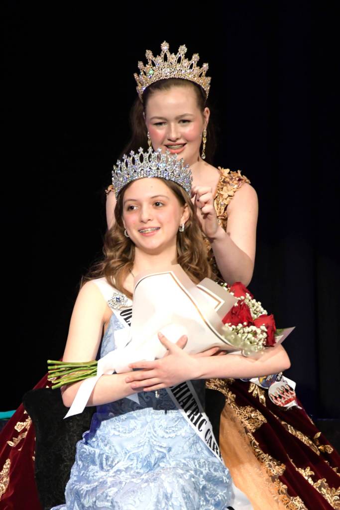 Sequim Gazette photo by Monica Berkseth/
Princess Roxy Woods crowns new princess Caroline Caudle on Feb. 21 in Sequim High Schools Auditorium.