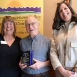 Sequim Gazette photo by Monica Berkseth/
Past Presidents of the Sequim-Dungeness Valley Chamber of Commerce Colleen Robinson, left, and Eran Kennedy, right, stand with 2025 Citizen of the Year recipient John Bridge on Feb. 24 at the awards luncheon in The Cedars at Dungeness.