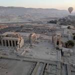 Photo courtesy Steve and Mirja Wilson/ A hot air balloon glides over the 3,300-year-old Luxor and Karnak temples at sunrise.