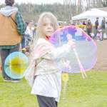 Sequim Gazette photo by Monica Berkseth
Luna Maynock, 4, has some fun with bubbles during Sequims annual Sunshine Festival on Saturday, March 7.