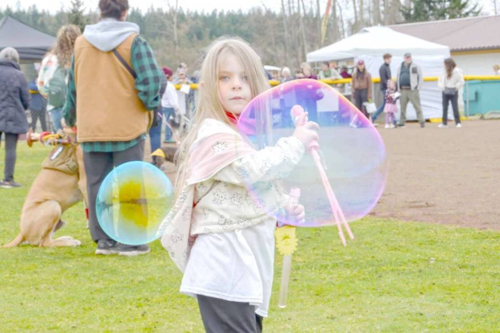 Sequim Gazette photo by Monica Berkseth
Luna Maynock, 4, has some fun with bubbles during Sequims annual Sunshine Festival on Saturday, March 7.