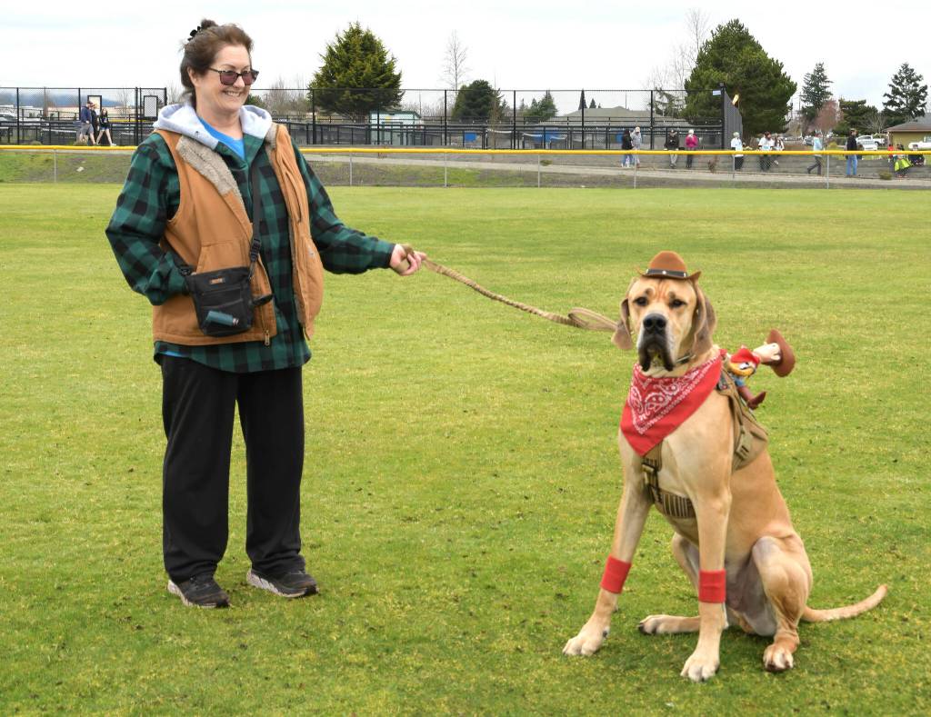 Sequim Gazette photo by Monica Berkseth 
Sir Dudley Dooright stands with his owner Darla Campbell on 
March 7 after winning the pet costume contest.