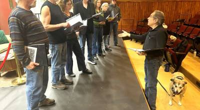Director/writer Steve Fisher, right, talks to actors about his Next Stage to Bellevue to be read aloud at Olympic Theatre Arts Readers Theatre program March 20-22. Actors, from left, include Joe Shulz, Ken Burland, Mary Daniel, Bill Stone, Rebecca Maberry, Tara Dupont, and August Maberry.
