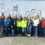 Sequim Gazette photo by Matthew Nash
Sequim Food Bank board members and staff stand together for a photo op to commemorate the transition between outgoing executive director Andra Smith and new director Jen Colmore. Colmore first worked as a volunteer and then the facilitys community engagement coordinator.