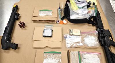 Photo courtesy OPNET/ Some of the evidence obtained during a suspected drug dealing operation broken up over two days included multiple weapons, just under 262 grams of fentanyl, more than 515 grams of methamphetamine, more than 30 grams of suspected cocaine, and nearly $19,000 in cash.