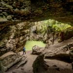 Photo courtesy John Gussman/ Trowutta Arch, a natural limestone arch that is considered a geological wonder, is in Tasmanias Trowutta Caves State Reserve. The reserve features two sinkholes, one of which is filled with a green-hued water and is more than 65 feet deep.