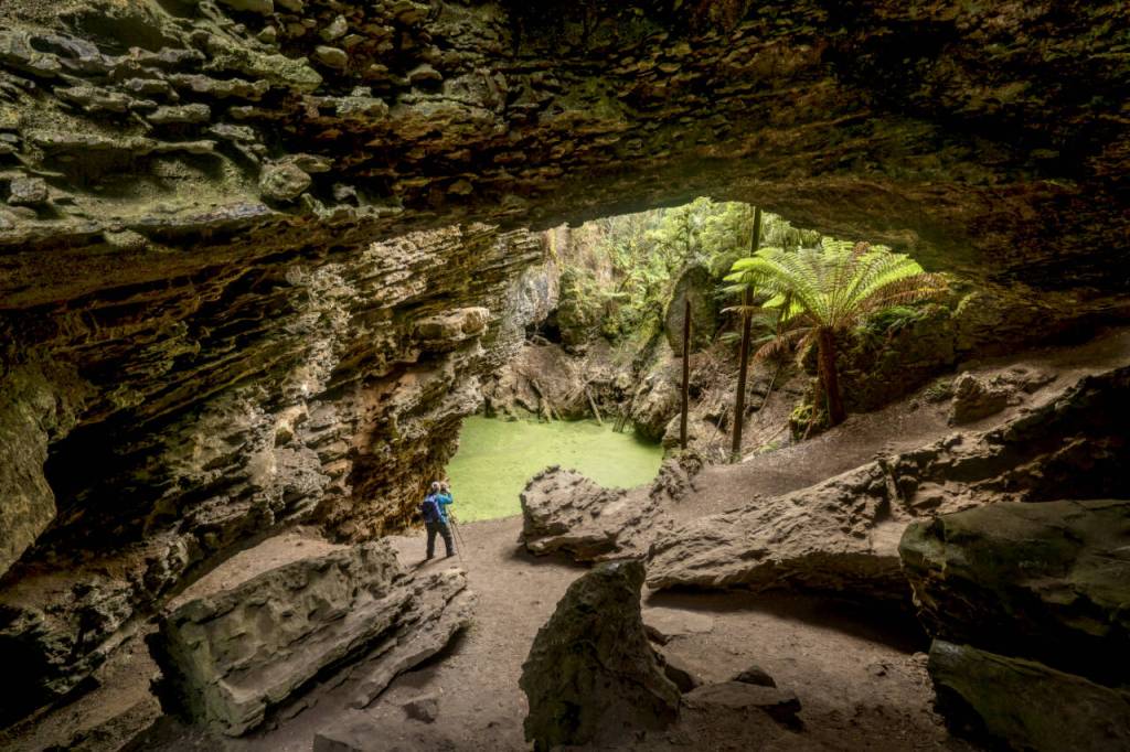 Photo courtesy John Gussman/ Trowutta Arch, a natural limestone arch that is considered a geological wonder, is in Tasmanias Trowutta Caves State Reserve. The reserve features two sinkholes, one of which is filled with a green-hued water and is more than 65 feet deep.