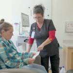 Photo courtesy Northwest Kidney Centers
Kidney patient Grabriele Ellis of Sequim receives instruction from Lara Severn, a nurse who manages Northwest Kidney Centers peritoneal dialysis program for the region. After receiving training from Severn at the nonprofits Port Angeles facility, Ellis was able to manage her own dialysis at home.