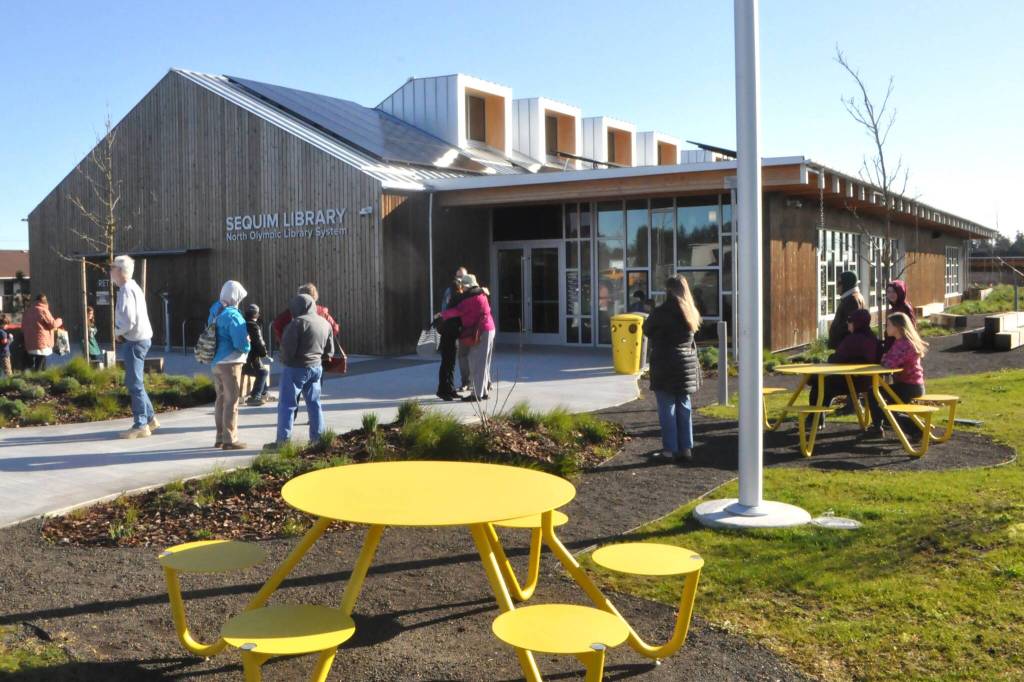 Sequim Gazette photos by Matthew Nash
Patrons gather shortly before the Sequim Library reopened on Saturday, March 21. It closed for renovations just over two years ago.