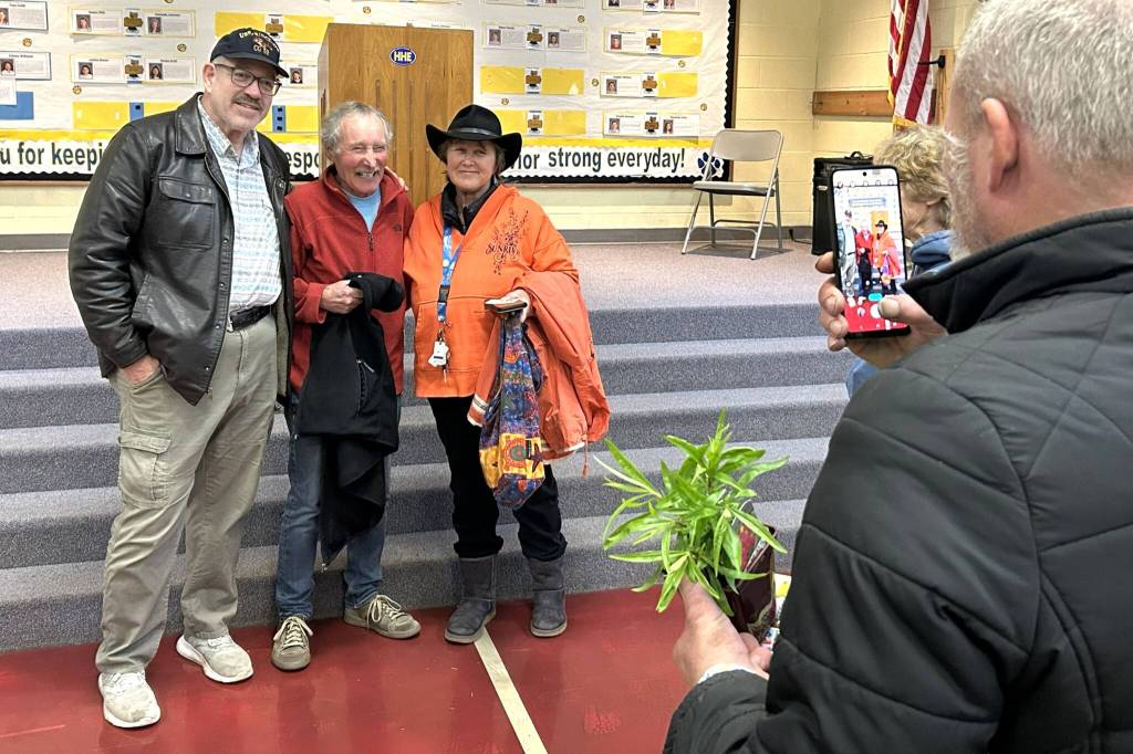 Sequim Gazette photo by Matthew Nash/ Ciscoe Morris, center, takes a photo with Sir Andrew Woodson with KSQM radio and Beberly Wamber after Morris lecture on March 22. Wamber said she watched Morris for years on TV and happened to run into him at Sunny Farms the day before and he invited her to his lecture during the Soroptimist Gala Garden Show.