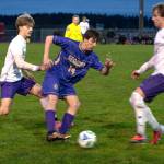 Photos by Emily Matthiessen 
Sequims Tristen Weston-Webb looks to move past North Kitsap defenders on March 19. The Wolves won their first game of the season 4-1 in Kingston and lost a close match 1-0 in Sequim against the Vikings.