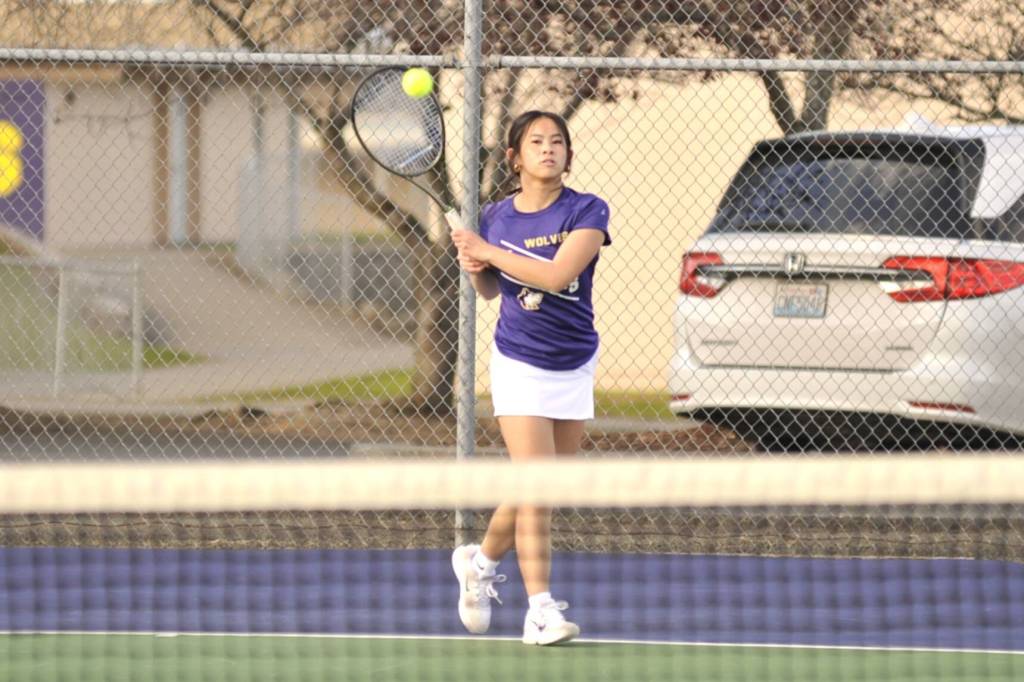 Sequim Gazette photo by Matthew Nash/ Tiffany Lam makes a hit during a March 26 match right before spring break.