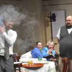 Sequim Gazette photo by Matthew Nash
Felix (Justin Stapleton) is surprised during a rehearsal of Olympic Theatre Arts The Odd Couple to find a smokier than normal version of his London broil burning as Oscar (Mario Arruda) and the Pigeon sisters watch.