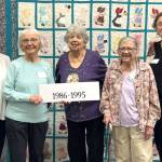 Sequim Gazette photo by Matthew Nash/
As part of their 40th anniversary celebration, Sunbonnet Sue Quilt Club members took group photos of club members by the decade they joined. For 1986-1995, club members include, from left, Joanne Thoma, Nancy Davis, Alicia Crawford, Marilyn Bosckis, and Norma Herbold.
