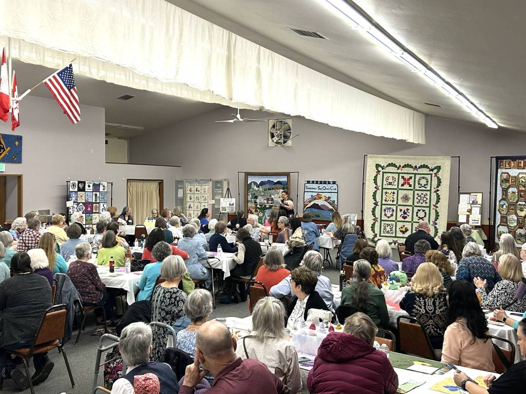 Sequim Gazette photo by Matthew Nash/
More than 100 people joined in the festivities for the Sunbonnet Sue Quilt Clubs 40th anniversary on April 8 in the Sequim Masonic Lodge. In its history, club members have donated thousands of quilts to local residents and agencies.