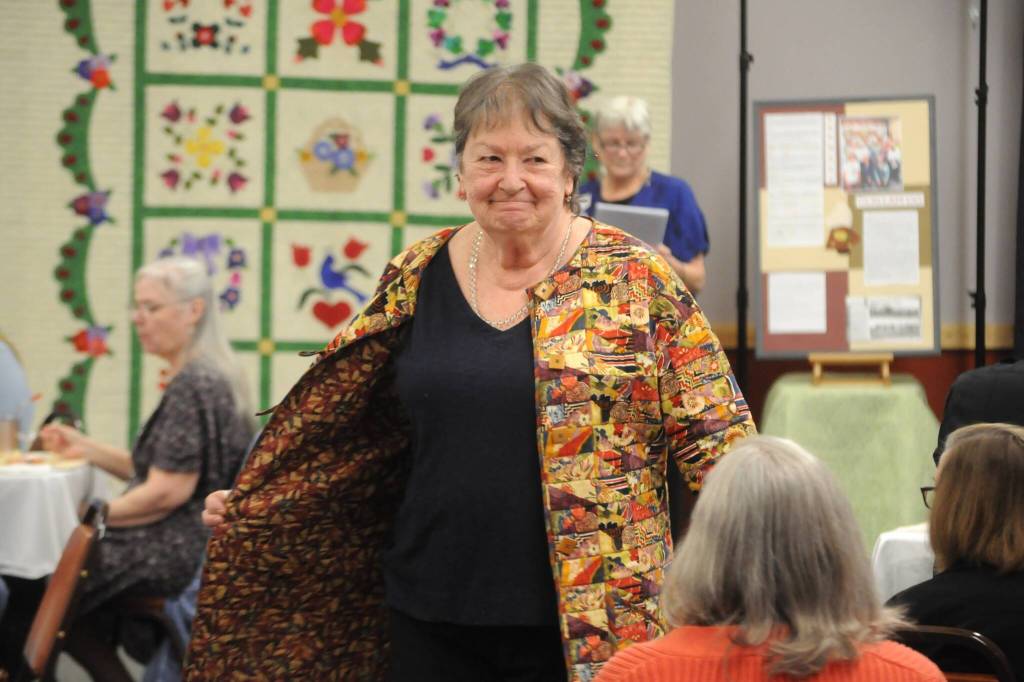 Sequim Gazette photo by Matthew Nash/
Mary-Lou Giacomelli, club president for the Sunbonnet Sue Quilt Club, models an outfit during the Wearable Fashion Show.