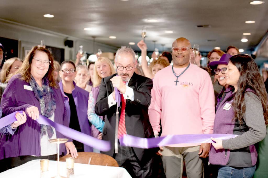 Harry Friedman, owner of the newly-opened Crazy Harrys Steakhouse at 206 N. Sequim Ave., is surrounded by representatives of the Sequim-Dungeness Valley Chamber of Commerce as he cuts the ribbon during a ribbon-cutting ceremony held at the restaurant on Friday, April 10. To view the restaurants menu, visit <a href="https://crazyharrys.com" target="_blank">crazyharrys.com</a>.