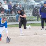 Sequims Rylie Doig makes a play for home plate against Olympic on April 17. The Trojans won the slugfest 17-7 in Sequim.